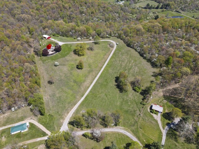aerial view featuring a view of trees