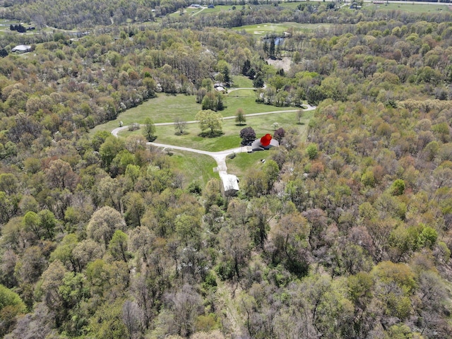 aerial view with a water view and a wooded view