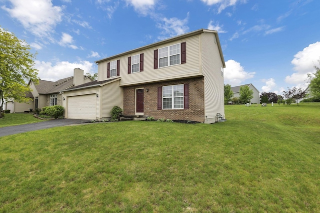 6495 Saylor St, Canal Winchester, OH 43110 - view of front of property with a garage, brick siding, driveway, and a front lawn