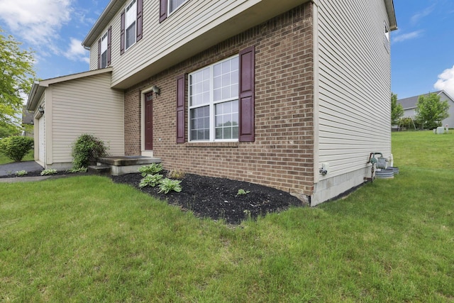6495 Saylor St, Canal Winchester, OH 43110 - view of side of property with brick siding and a lawn