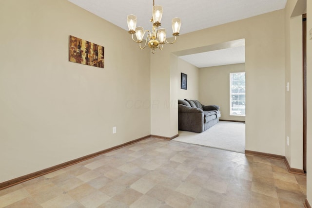 6495 Saylor St, Canal Winchester, OH 43110 - unfurnished room with a chandelier, baseboards, and light floors
