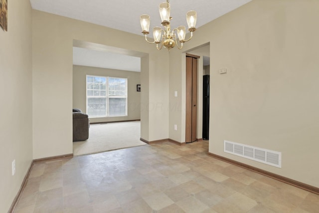 6495 Saylor St, Canal Winchester, OH 43110 - spare room featuring tile patterned floors, a chandelier, and baseboards