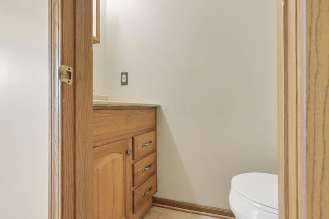 6495 Saylor St, Canal Winchester, OH 43110 - half bath featuring vanity, toilet, tile patterned flooring, and baseboards