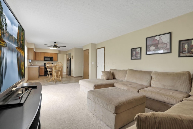 6495 Saylor St, Canal Winchester, OH 43110 - living room with ceiling fan, light colored carpet, and a textured ceiling