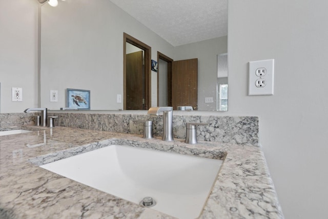 6495 Saylor St, Canal Winchester, OH 43110 - bathroom with double vanity and a textured ceiling