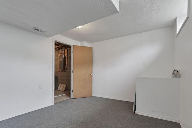 6495 Saylor St, Canal Winchester, OH 43110 - spare room with electric panel, carpet flooring, baseboards, and a textured ceiling