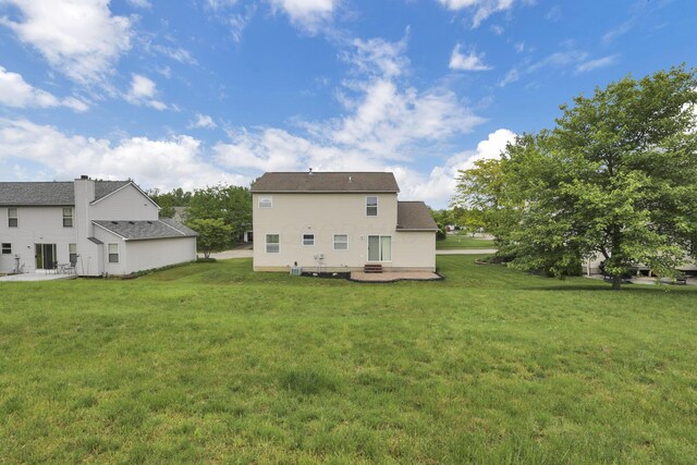 6495 Saylor St, Canal Winchester, OH 43110 - rear view of house featuring a patio area and a yard