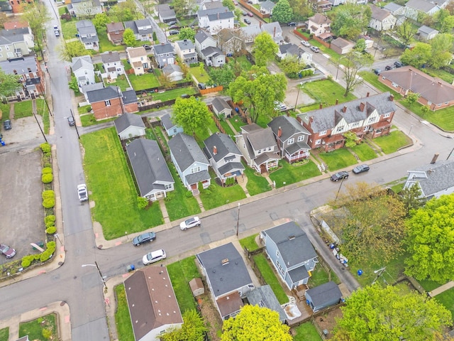 aerial view of property and surrounding area with nearby suburban area