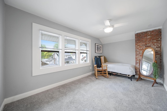 bedroom featuring carpet floors, baseboards, ceiling fan, and lofted ceiling