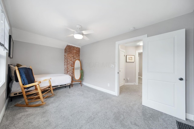 living area featuring carpet floors, ceiling fan, and baseboards