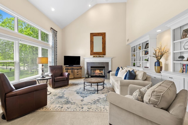 2543 Kemperwood Dr, Blacklick, OH 43004 - living area with high vaulted ceiling, a tiled fireplace, built in features, and carpet floors