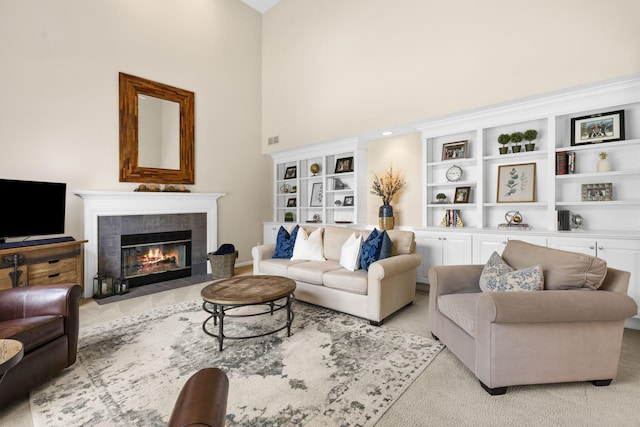 2543 Kemperwood Dr, Blacklick, OH 43004 - living room with a high ceiling, a tile fireplace, and light colored carpet