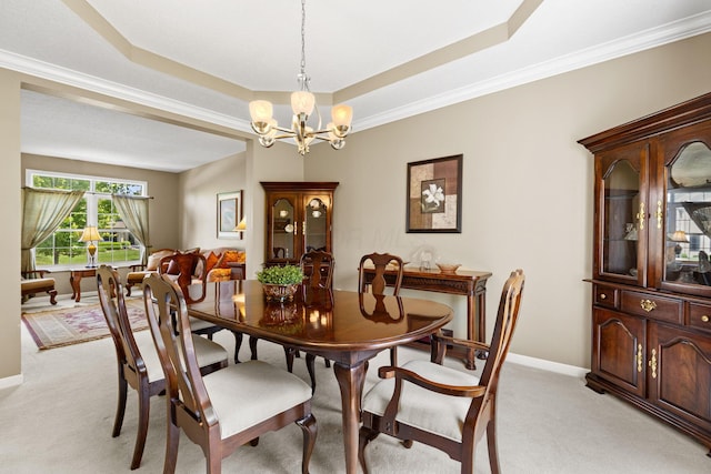 2543 Kemperwood Dr, Blacklick, OH 43004 - dining area featuring light carpet, a raised ceiling, a chandelier, ornamental molding, and baseboards