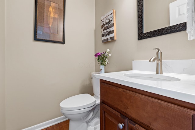 2543 Kemperwood Dr, Blacklick, OH 43004 - half bath featuring vanity, toilet, wood finished floors, and baseboards