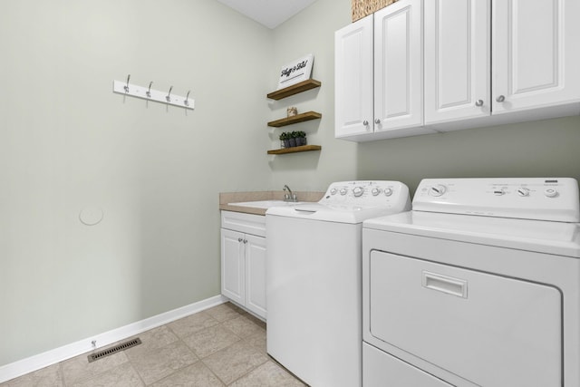 2543 Kemperwood Dr, Blacklick, OH 43004 - washroom featuring cabinet space, washer and clothes dryer, and baseboards