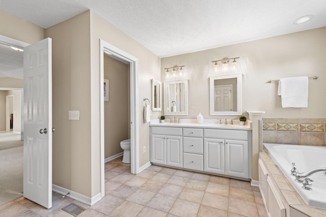 2543 Kemperwood Dr, Blacklick, OH 43004 - full bathroom featuring double vanity, a bath, and toilet