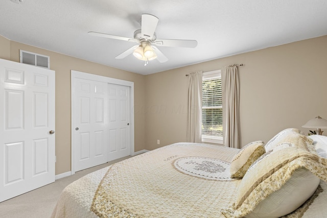 2543 Kemperwood Dr, Blacklick, OH 43004 - bedroom with light carpet, a closet, a ceiling fan, and baseboards