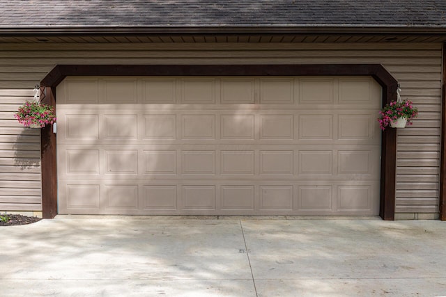 garage with concrete driveway