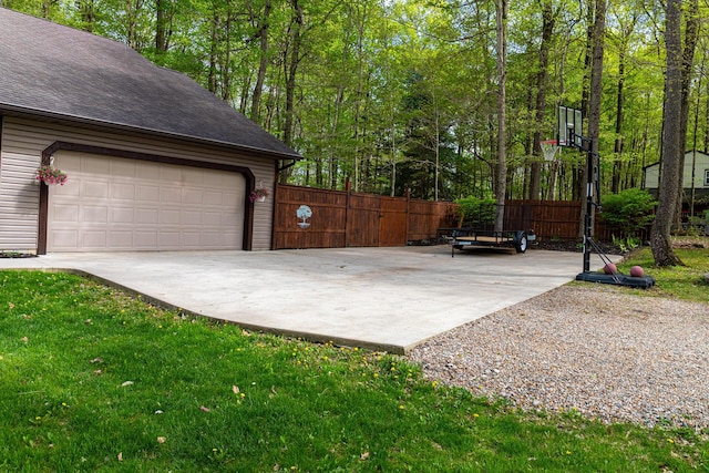 exterior space with fence and driveway