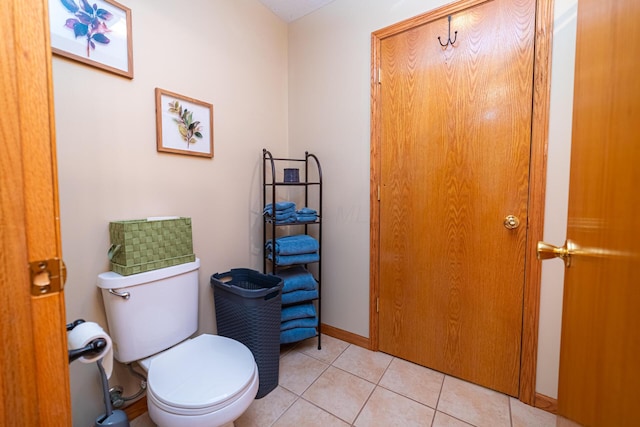 bathroom featuring toilet and tile patterned floors
