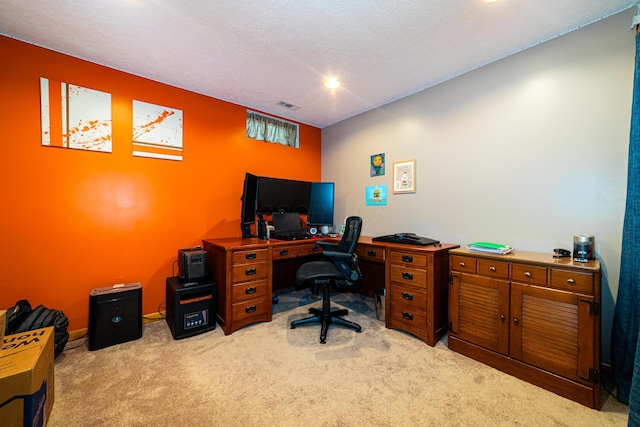 carpeted home office featuring recessed lighting, a textured ceiling, and visible vents