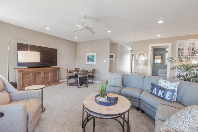 living room with carpet floors, a ceiling fan, and recessed lighting