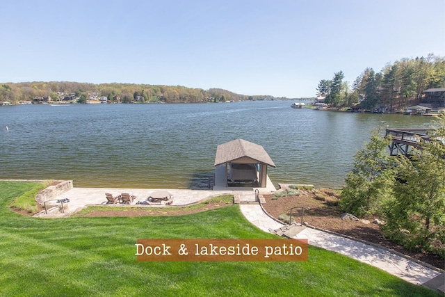 view of dock featuring a water view and a lawn