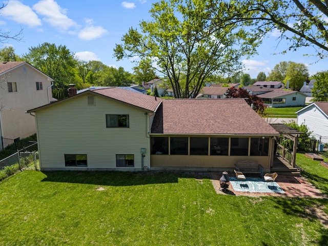 746 Ronson Ave, Columbus, OH 43230 - rear view of property featuring a patio area, a sunroom, roof with shingles, and a chimney