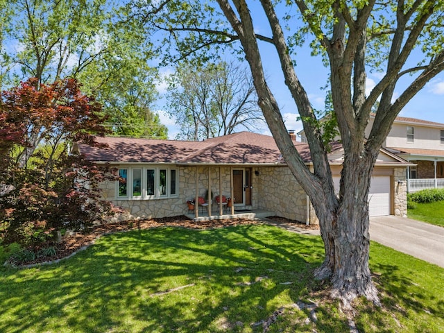 746 Ronson Ave, Columbus, OH 43230 - view of front of home featuring stone siding, driveway, a garage, and a front lawn