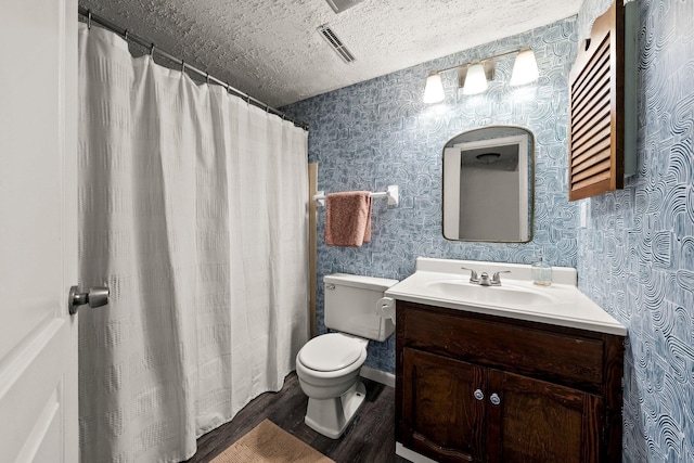746 Ronson Ave, Columbus, OH 43230 - bathroom with wallpapered walls, wood finished floors, a textured ceiling, toilet, and vanity