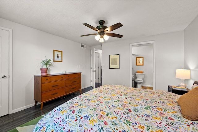 746 Ronson Ave, Columbus, OH 43230 - bedroom with baseboards, dark wood-style flooring, ceiling fan, and connected bathroom