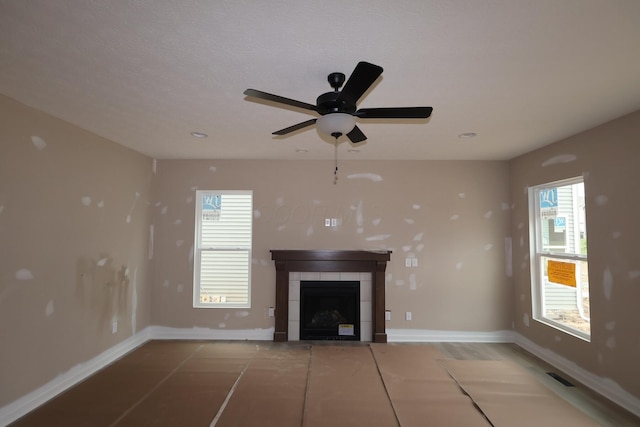 1012 Heimat Haus Dr N, Grove City, OH 43123 - unfurnished living room featuring a tile fireplace, baseboards, a ceiling fan, and recessed lighting