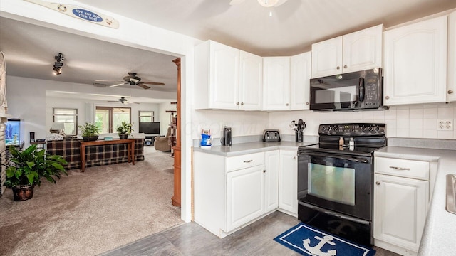 14672 Township Rd Unit 1062, Thornville, OH 43076 - kitchen with black appliances, ceiling fan, white cabinetry, and light countertops