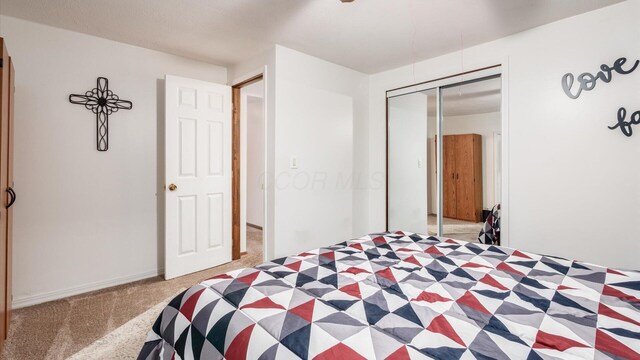 14672 Township Rd Unit 1062, Thornville, OH 43076 - carpeted bedroom featuring a closet and baseboards