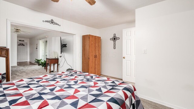 14672 Township Rd Unit 1062, Thornville, OH 43076 - bedroom with light carpet, a ceiling fan, and baseboards