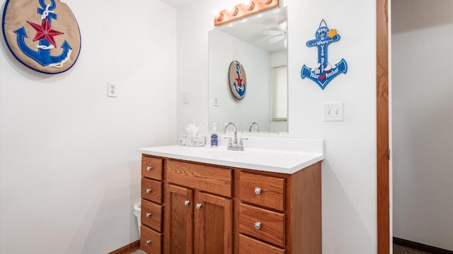 14672 Township Rd Unit 1062, Thornville, OH 43076 - half bathroom featuring vanity, ceiling fan, toilet, and baseboards