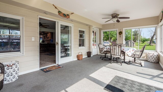 14672 Township Rd Unit 1062, Thornville, OH 43076 - sunroom / solarium featuring a ceiling fan, carpet, and wood walls