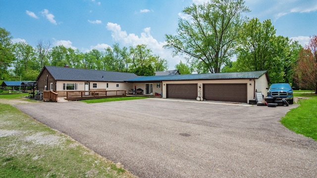 14672 Township Rd Unit 1062, Thornville, OH 43076 - single story home featuring driveway, an attached garage, and a deck