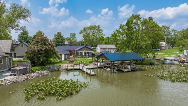 14672 Township Rd Unit 1062, Thornville, OH 43076 - dock area featuring boat lift, a water view, a yard, and a residential view