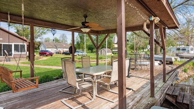 14672 Township Rd Unit 1062, Thornville, OH 43076 - deck featuring outdoor dining area, a yard, and a ceiling fan