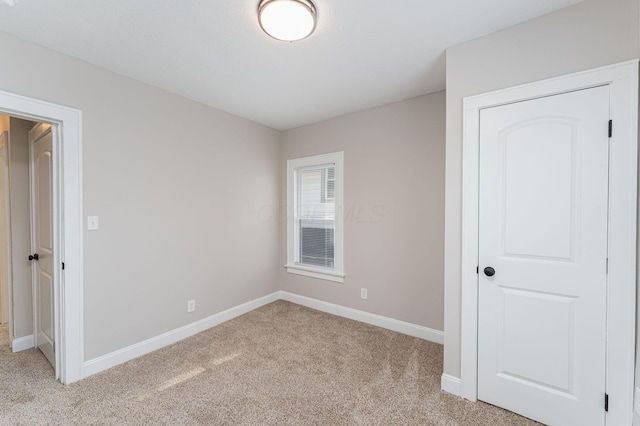 146 E Woodrow Ave, Columbus, OH 43207 - unfurnished bedroom featuring light carpet and baseboards