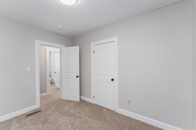 146 E Woodrow Ave, Columbus, OH 43207 - unfurnished bedroom with light colored carpet and baseboards