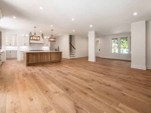 2355 Farleigh Rd, Columbus, OH 43221 - kitchen with a spacious island, light wood finished floors, recessed lighting, open floor plan, and light countertops