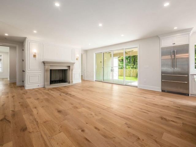 2355 Farleigh Rd, Columbus, OH 43221 - unfurnished living room with light wood-type flooring, recessed lighting, baseboards, and a fireplace