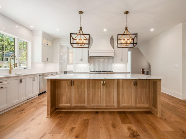 2355 Farleigh Rd, Columbus, OH 43221 - kitchen featuring custom exhaust hood, a chandelier, a sink, light countertops, and tasteful backsplash