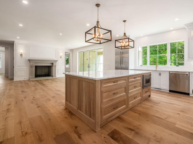 2355 Farleigh Rd, Columbus, OH 43221 - kitchen featuring dishwasher, light wood finished floors, white cabinets, recessed lighting, and open floor plan