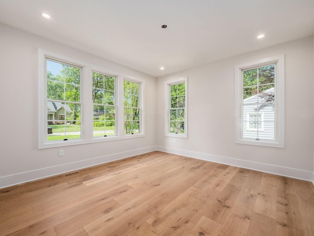 2355 Farleigh Rd, Columbus, OH 43221 - empty room with baseboards, light wood-style flooring, plenty of natural light, and recessed lighting