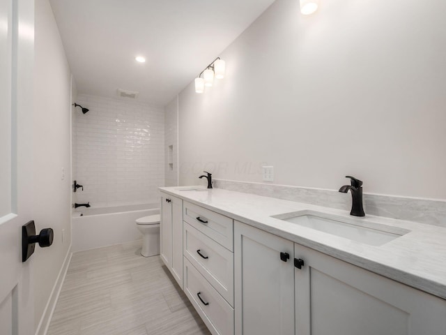 2355 Farleigh Rd, Columbus, OH 43221 - full bath featuring double vanity, toilet, tub / shower combination, baseboards, and recessed lighting