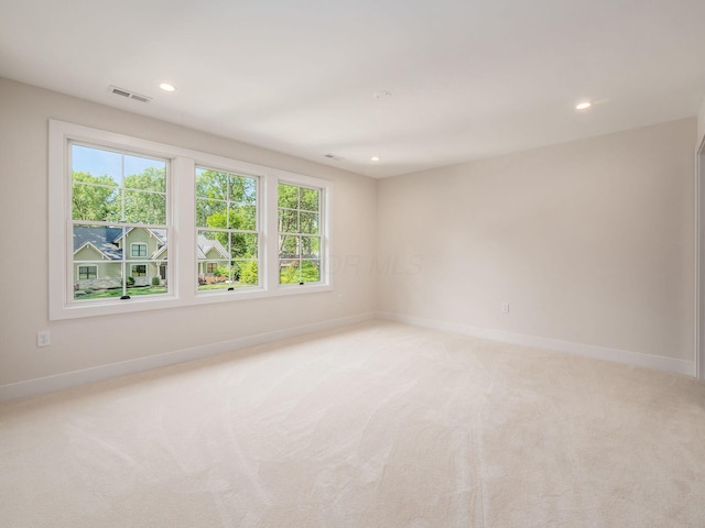 2355 Farleigh Rd, Columbus, OH 43221 - empty room featuring baseboards, light colored carpet, plenty of natural light, and recessed lighting