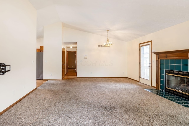 4977 Softwood Ct, Westerville, OH 43081 - unfurnished living room featuring carpet, vaulted ceiling, a tiled fireplace, and baseboards